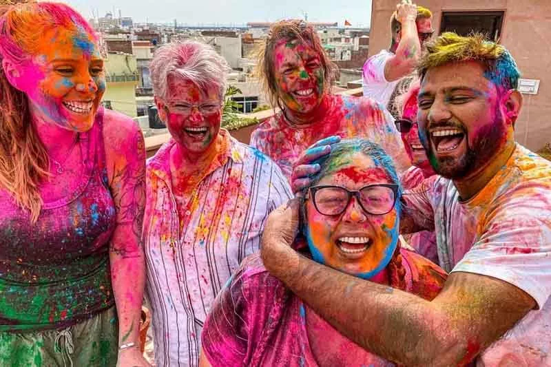 Colorful Holi festival celebrations across North India with joyful music and dancing