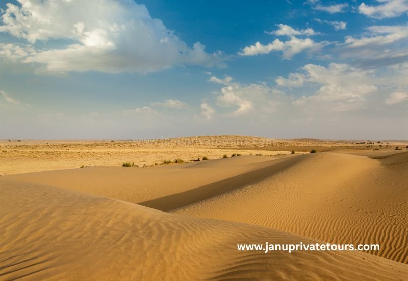 Exciting camel safari ride across the Thar desert dunes during sunset in Jaisalmer