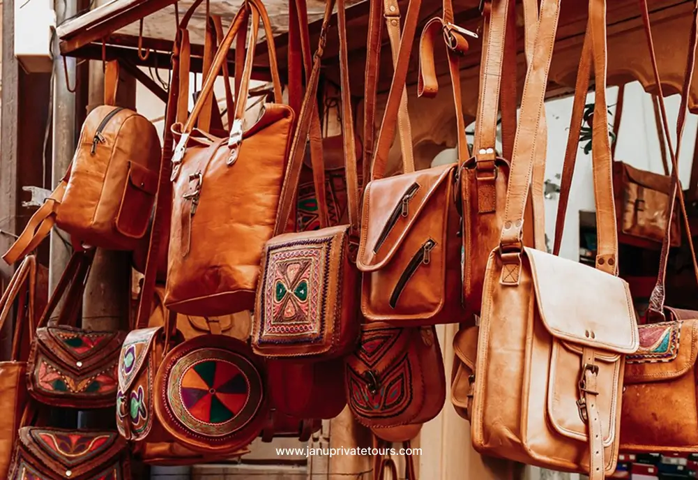 Handcrafted leather bags displayed at a Udaipur market